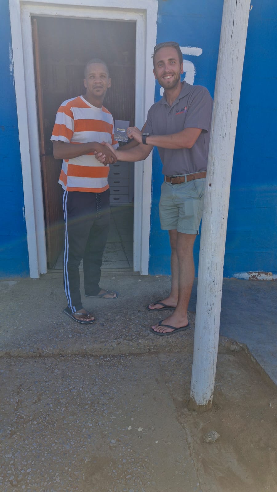 SkuifNet team member during a local community handover