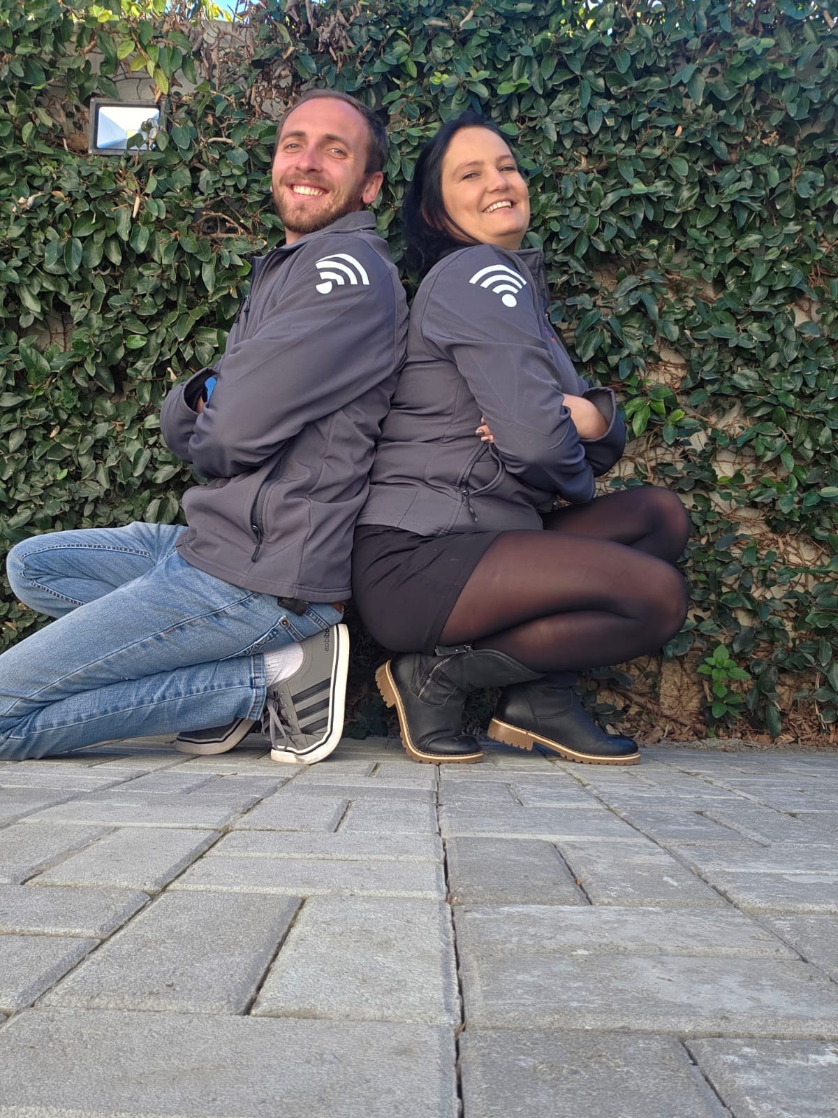 SkuifNet owners Eddie and Maruschka outdoors in branded jackets
